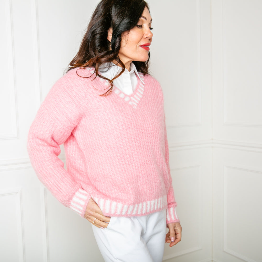 The pink Knitted Prep Sweater made from a blend of nylon, wool and recycled polyester