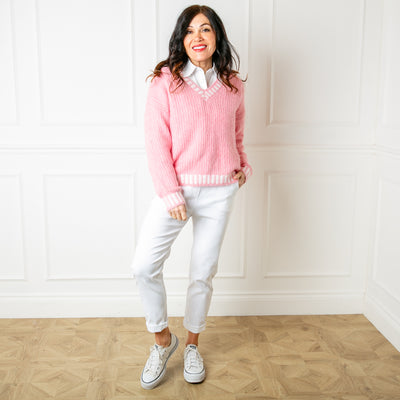 The Knitted Prep Sweater in pink which is great for layering a shirt underneath for a preppy look