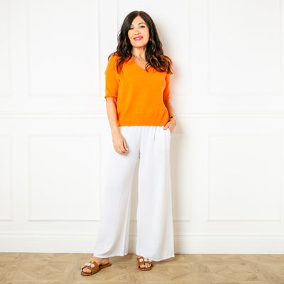 The orange Knitted Short Sleeve Jumper with ribbed detailing on the sleeves and bottom hemline