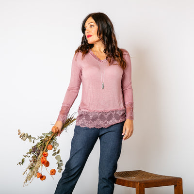 The blush pink Lace Trim Top, made from a soft stretchy material