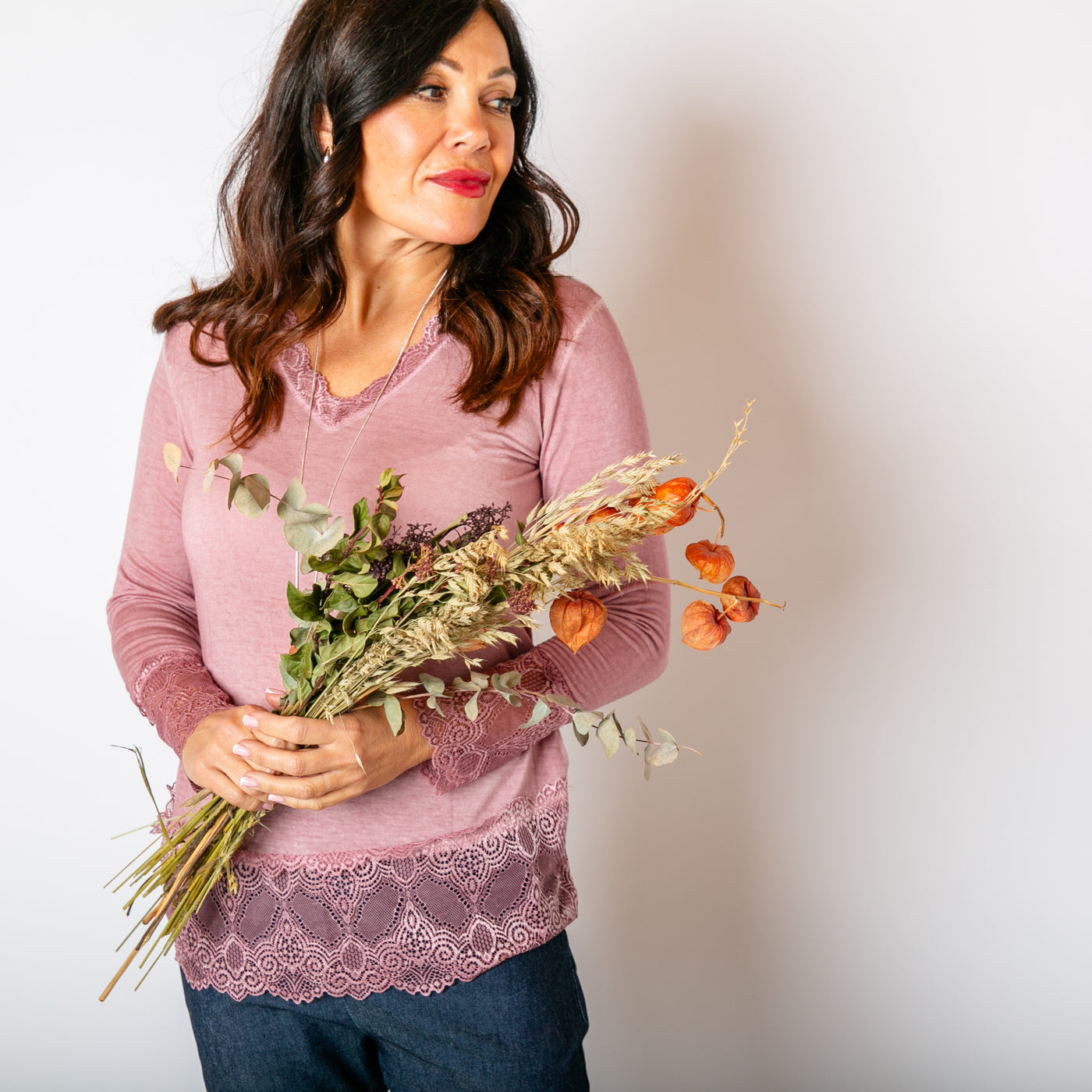 The blush pink Lace Trim Top with long sleeves and a v neckline