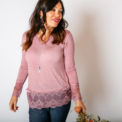 The blush pink Lace Trim Top with lace detailing around the sleeves, neckline and bottom hemline 