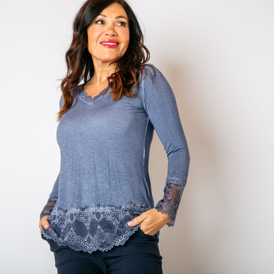 The denim blue Lace Trim Top with lace detailing around the sleeves, neckline and bottom hemline 