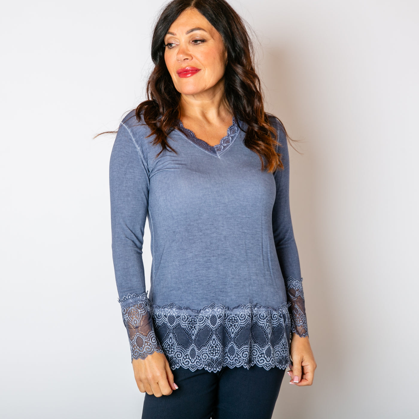 The denim blue Lace Trim Top with long sleeves and a v neckline