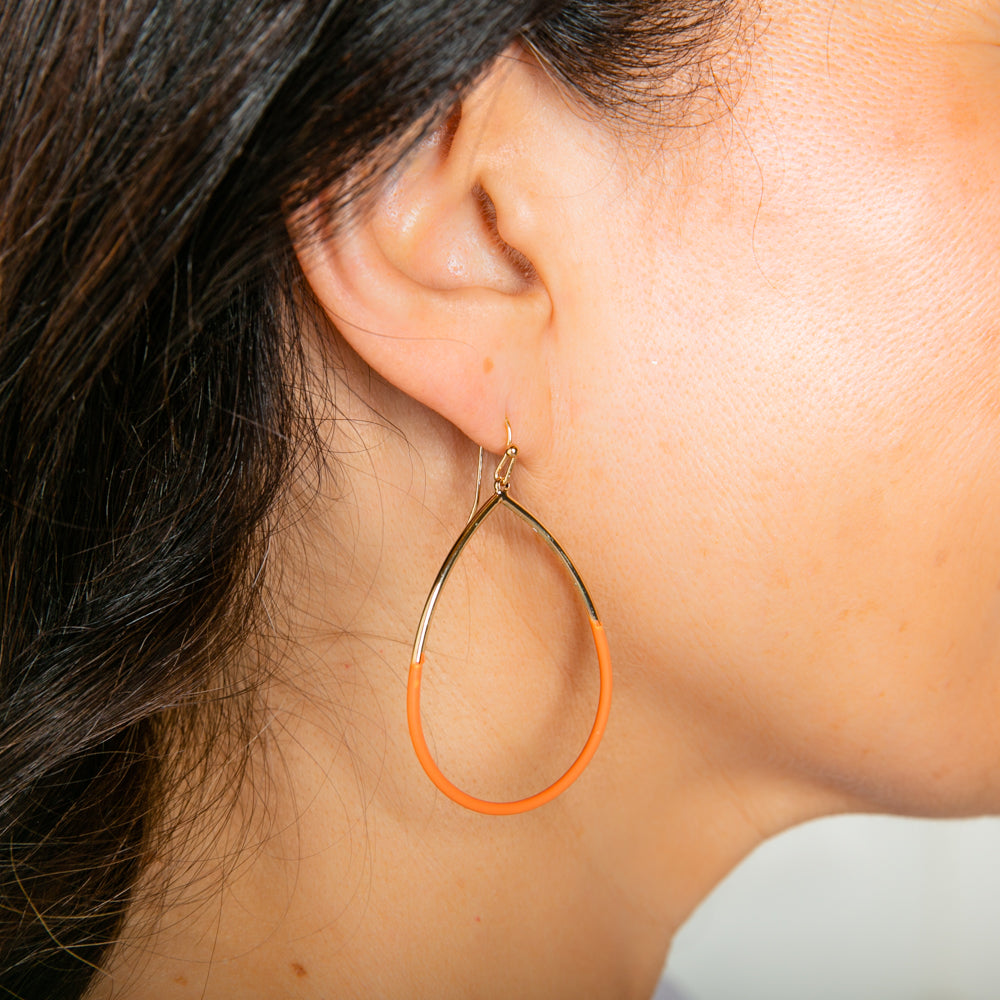 The Leah earrings in orange with a hook fastening. Great for dressing up an outfit