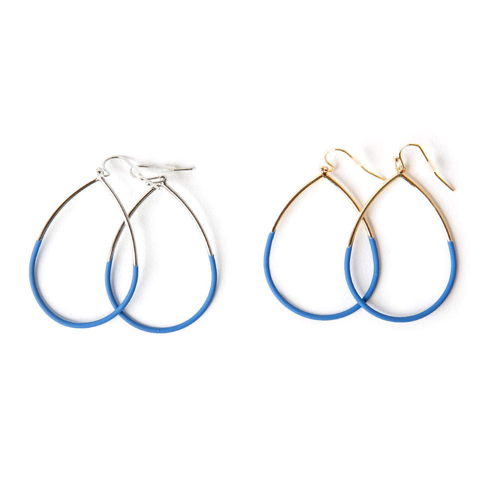 The Leah Earrings in royal blue featuring a teardrop shape. Available in gold and silver