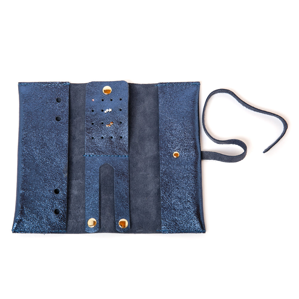 The Leather Jewellery Wrap Pouch in navy blue with compartments for storing rings, earrings, bracelets and necklaces