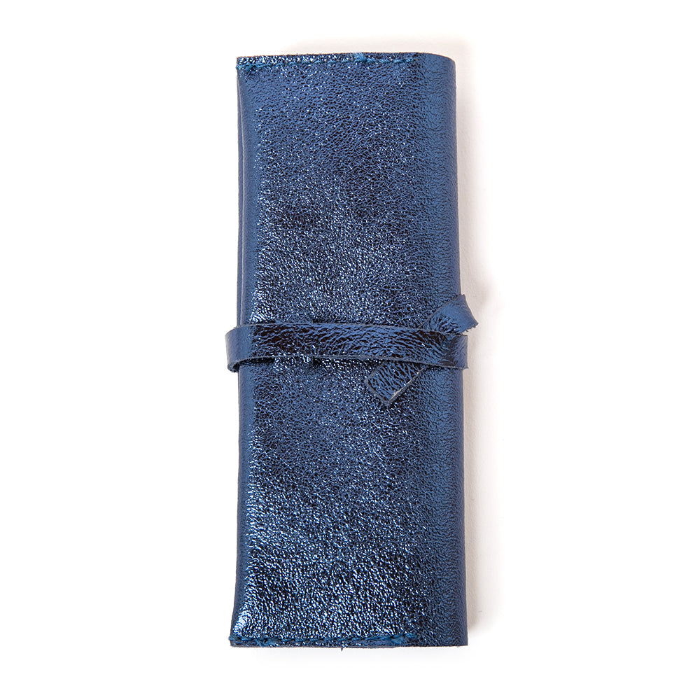 The Leather Jewellery Wrap Pouch in navy blue with a wrap around tie fastening so you can fill to your hearts content