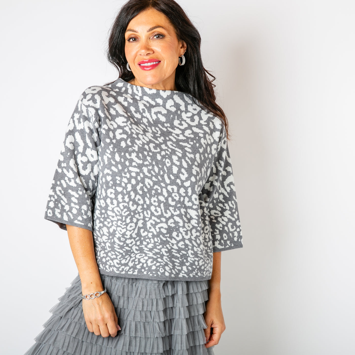 The grey Leopard Boxy Jumper featuring a bold animal print pattern