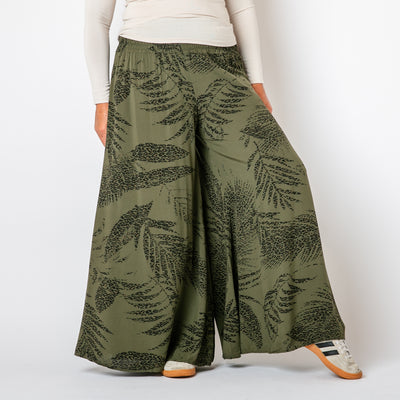 The khaki green Leopard Leaf Wide Leg Trousers with an extra wide, palazzo pant silhouette