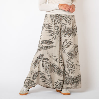 The stone cream Leopard Leaf Wide Leg Trousers featuring a gorgeous animal print leaf feather pattern