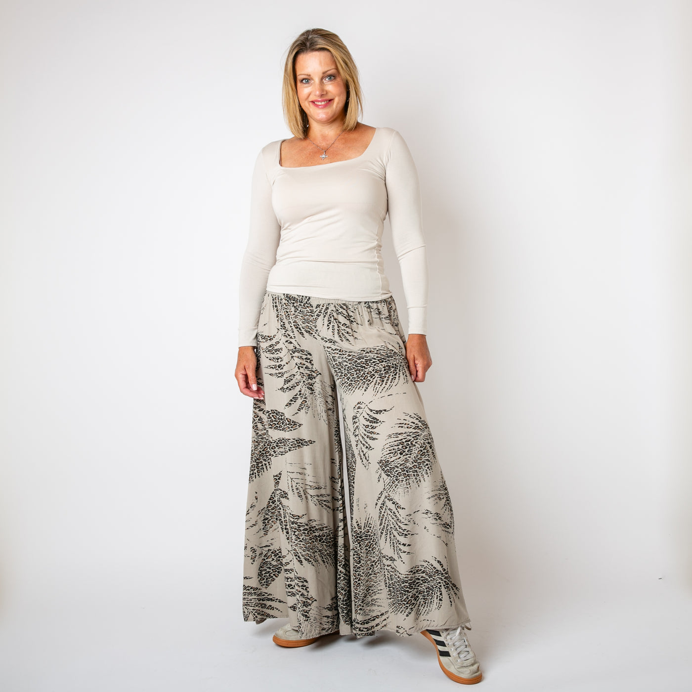 The stone cream Leopard Leaf Wide Leg Trousers with an extra wide, palazzo pant silhouette