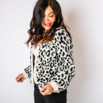 The black Leopard Print Cardigan made from a chunky knitted blend of wool, acrylic and viscose