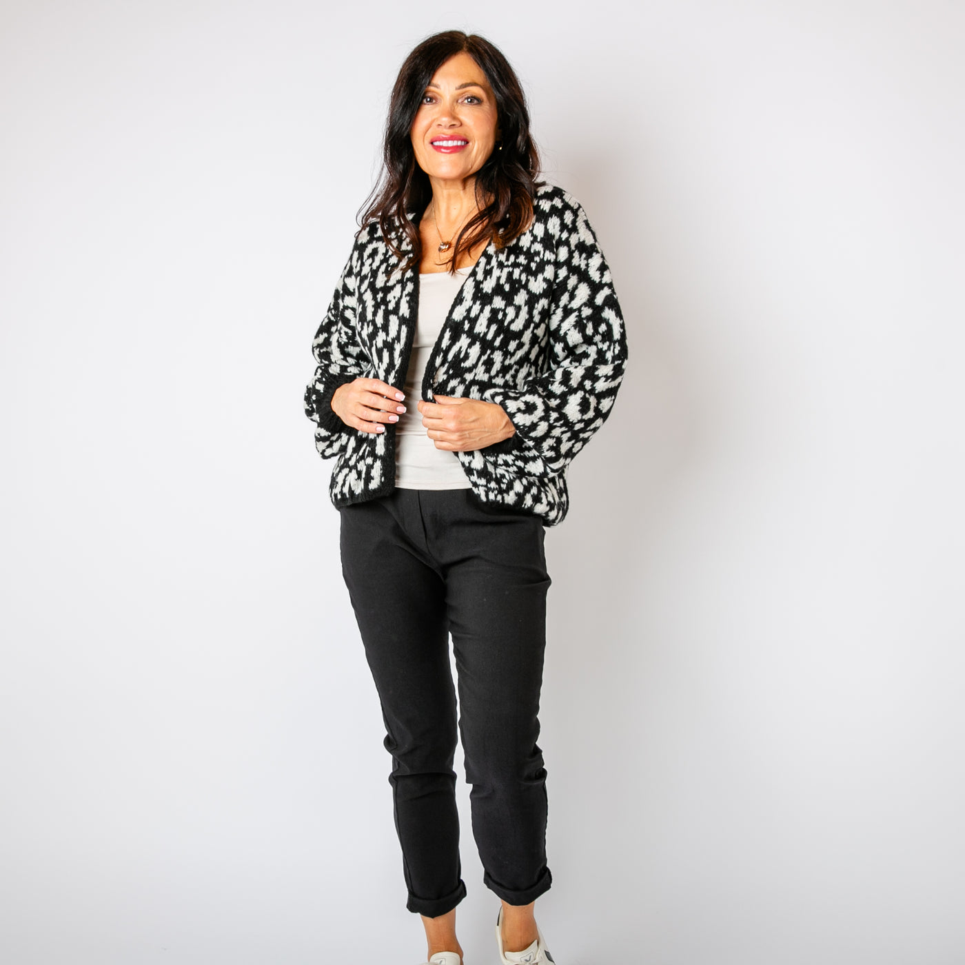 The monochrome Leopard Print Cardigan featuring a fun animal print pattern in contrasting colours