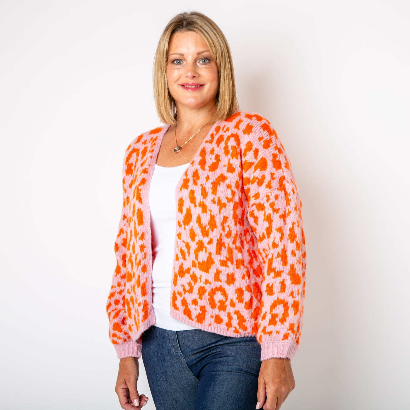 The orange Leopard Print Cardigan featuring a fun animal print pattern in contrasting colours