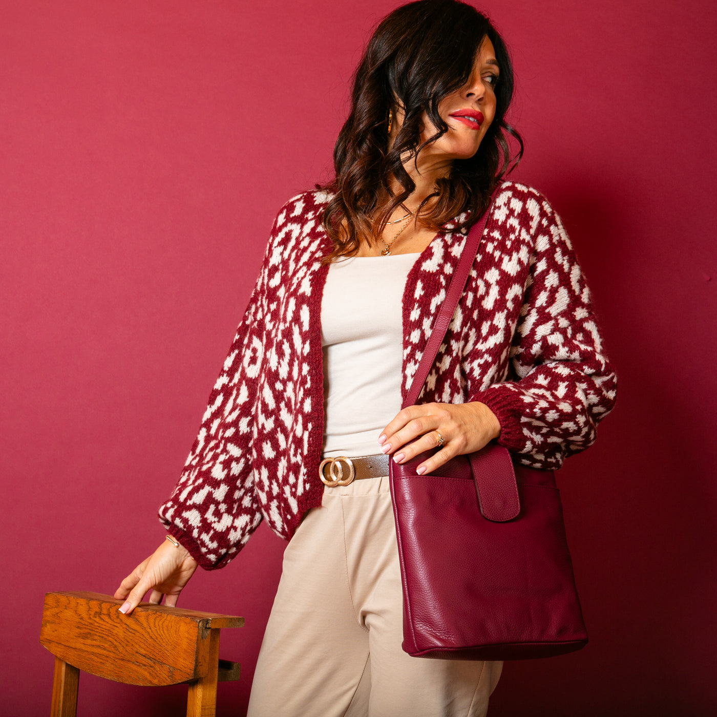 The wine red Leopard Print Cardigan featuring a fun animal print pattern in contrasting colours