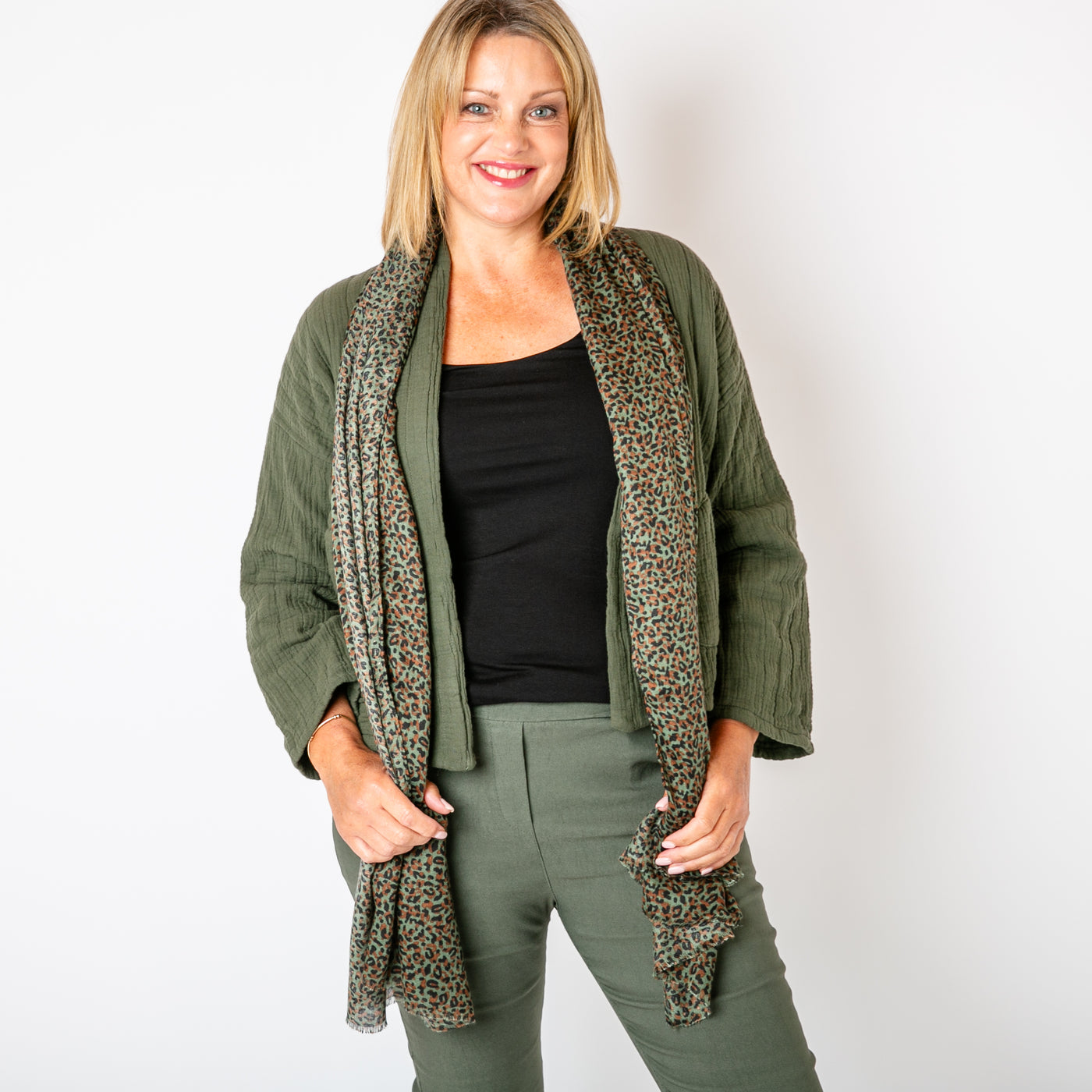 The khaki green Leopard Print Scarf featuring a fun, bold animal print pattern