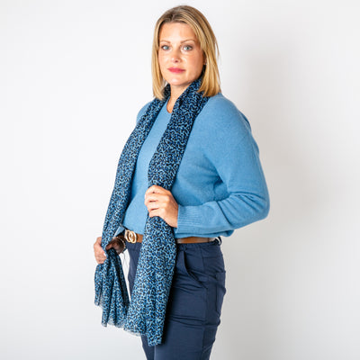 The navy blue Leopard Print Scarf featuring a fun, bold animal print pattern