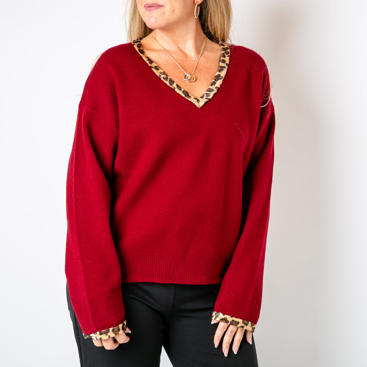 The burgundy red Leopard Trim Jumper with long sleeves and a v neckline