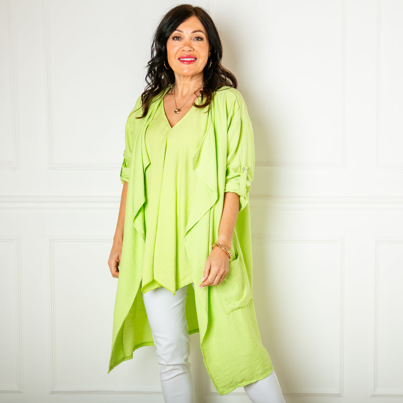 The lime green Lightweight Waterfall Jacket with long sleeves that can be rolled up and buttoned at the elbow