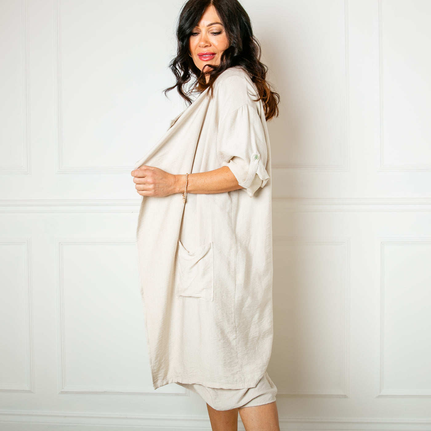 The stone cream Lightweight Waterfall Jacket with pockets on either side and an open draped front