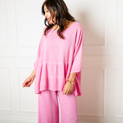 The Linen Blend Tiered Top in candy pink with 3/4 length sleeves and a round neckline