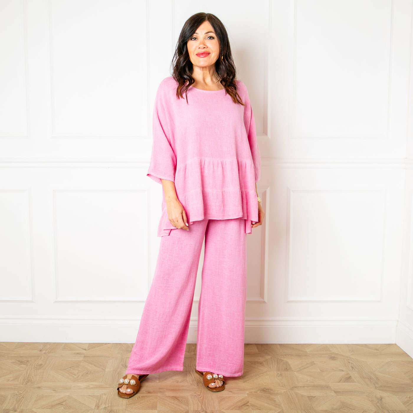 The candy pink Linen Blend Tiered Top made from a mix of cotton and linen for a lightweight relaxed summer look