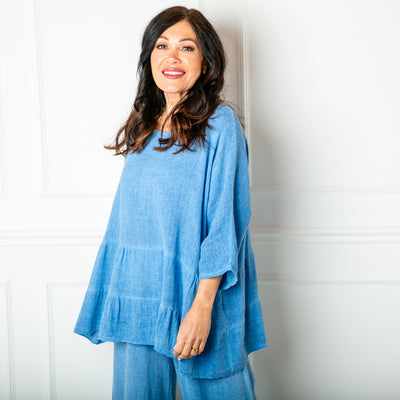 The Linen Blend Tiered Top in cornflower blue with a loose tiered peplum silhouette