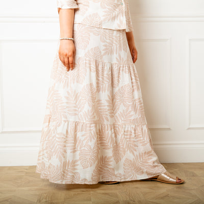 The cream Linen Leaf Tiered Skirt in a maxi skirt length with a tiered silhouette