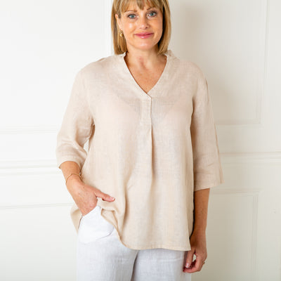 The Linen Tunic Top in natural cream stone with 3/4 length sleeves and a collarless v neckline