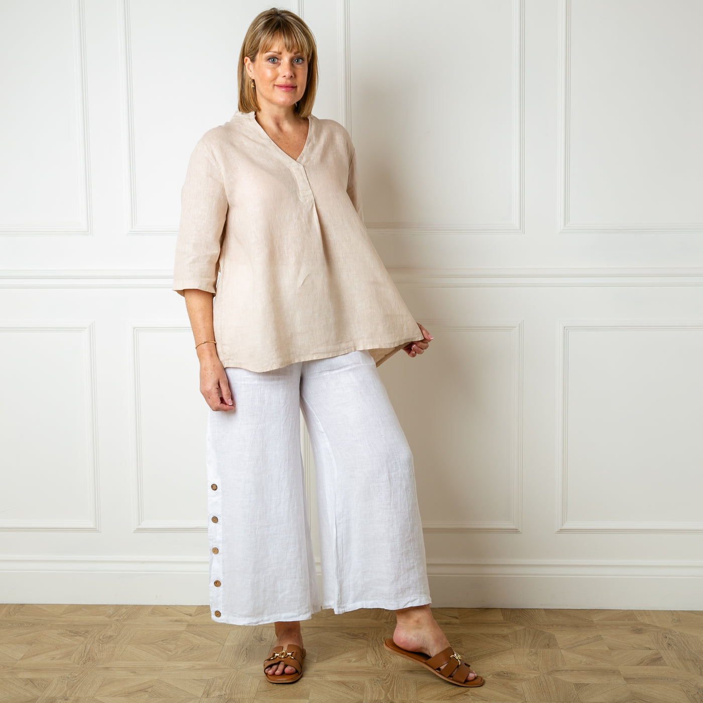 The Linen Tunic Top in natural stone cream which is perfect for a relaxed summer look 