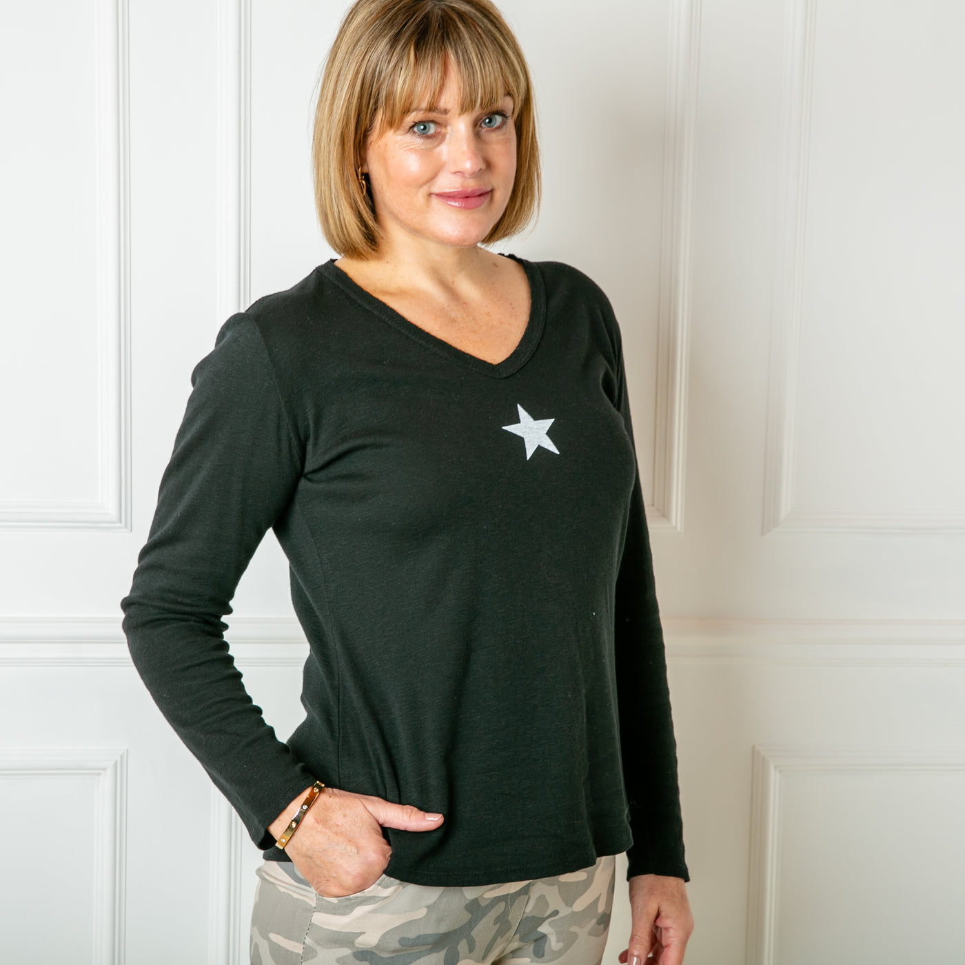 The black Long Sleeve Star Top with a v necklien and full length sleeves