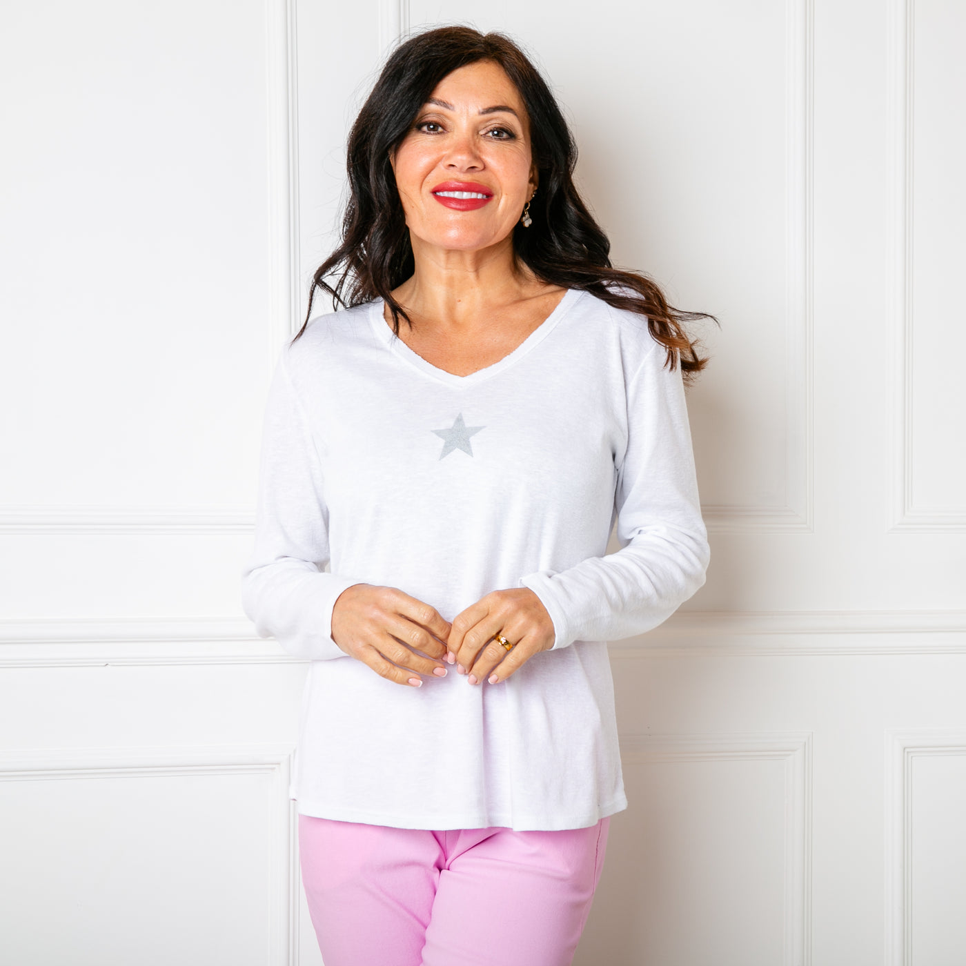The white Long Sleeve Star Top with a v necklien and full length sleeves