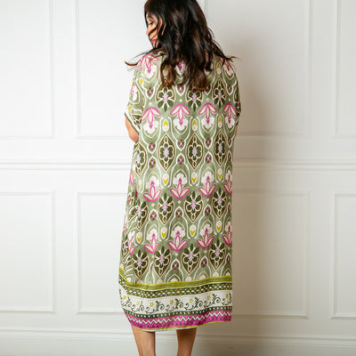 The olive green Lotus Flower Sun Dress in a beautiful summery floral pattern in a lightweight soft fabric