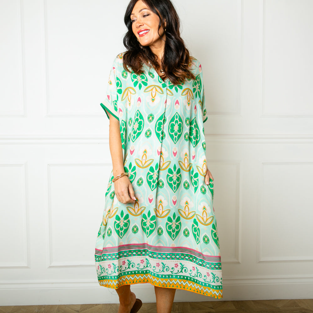 The peppermint green Lotus Flower Sun Dress with short sleeves that have a ribbed stretchy cuff around the edge