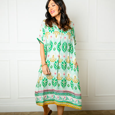 The peppermint green Lotus Flower Sun Dress with short sleeves that have a ribbed stretchy cuff around the edge
