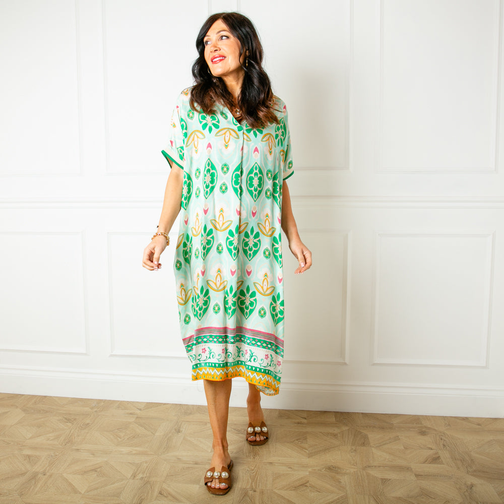The peppermint green Lotus Flower Sun Dress featuring a beautiful colourful floral pattern