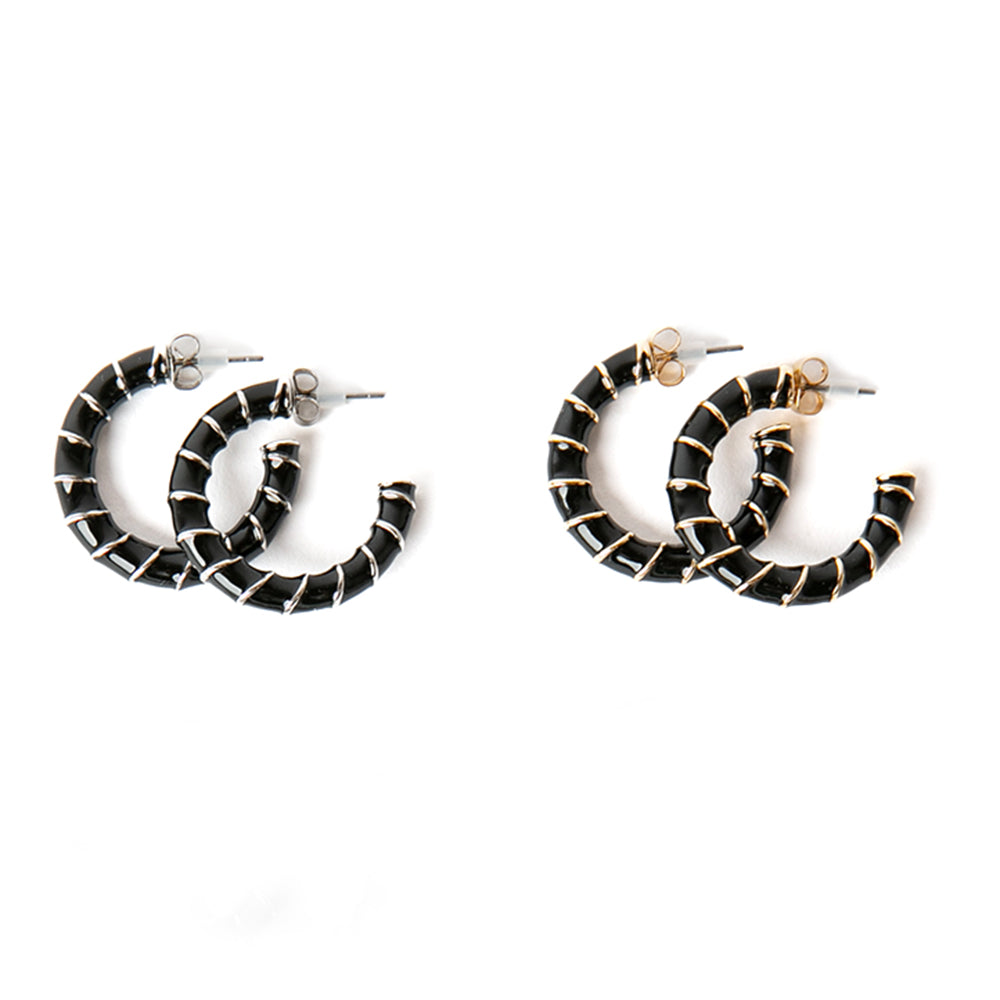 The Lucy earring in black with metal stripes, Available in gold or silver plating 