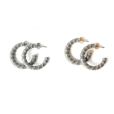 The Lucy earring in grey with metal stripes, Available in gold or silver plating 