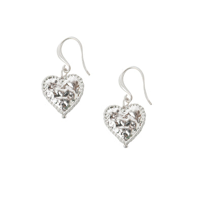 The Mehri Earrings in silver which feature a gorgeous shiny hammered heart with a hook fastening on the end