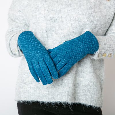 The Mollie Gloves in teal blue which make the perfect finishing touch for any winter outfit