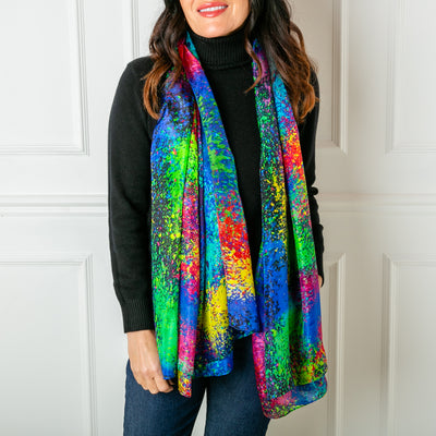 The Multicolour Droplets Silk Scarf which can be worn in lots of different ways to finish an outfit