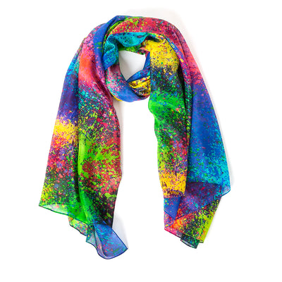 The Multicolour Droplets Silk Scarf in rainbow featuring a paint splatter effect pattern 