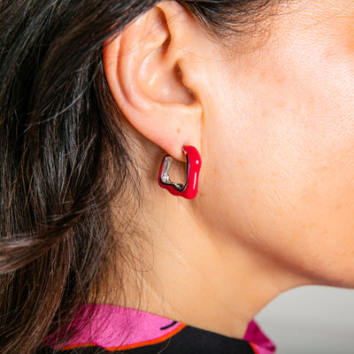 The Nadine Earrings in fuchsia pink red, available in gold and silver plating