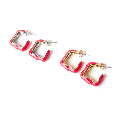 The Nadine earrings in fuchsia pink red with a quirky shape and butterfly back fastenings