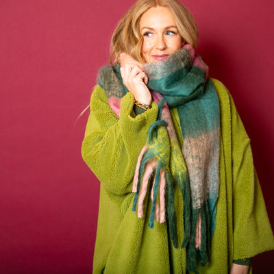 The Green Nelly Check Scarf with hints of yellow, pink and brown running throughout