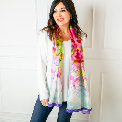The Neon Bloom Silk Scarf which can be worn in lots of different ways