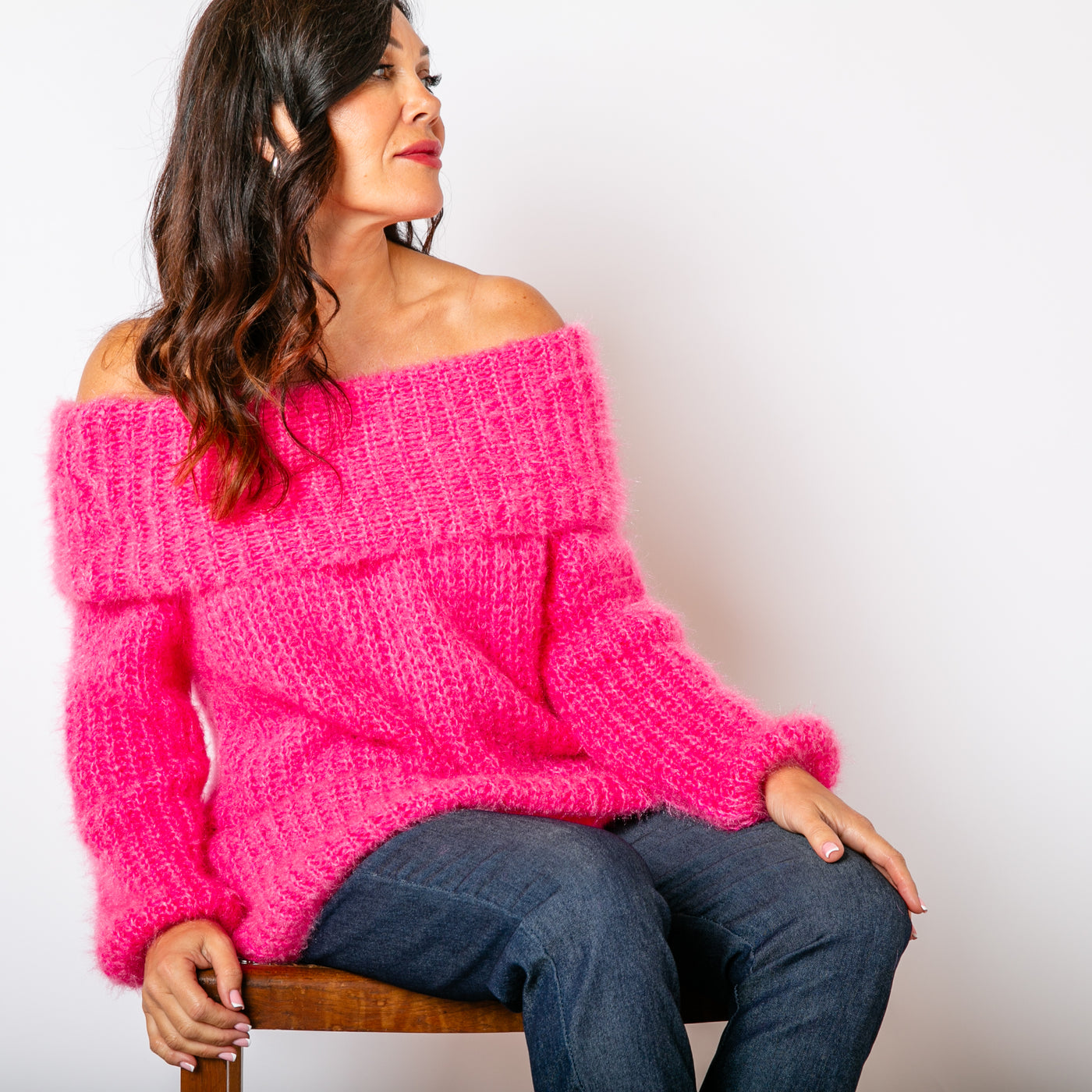 The Off Shoulder Jumper in fuchsia pink with long sleeves