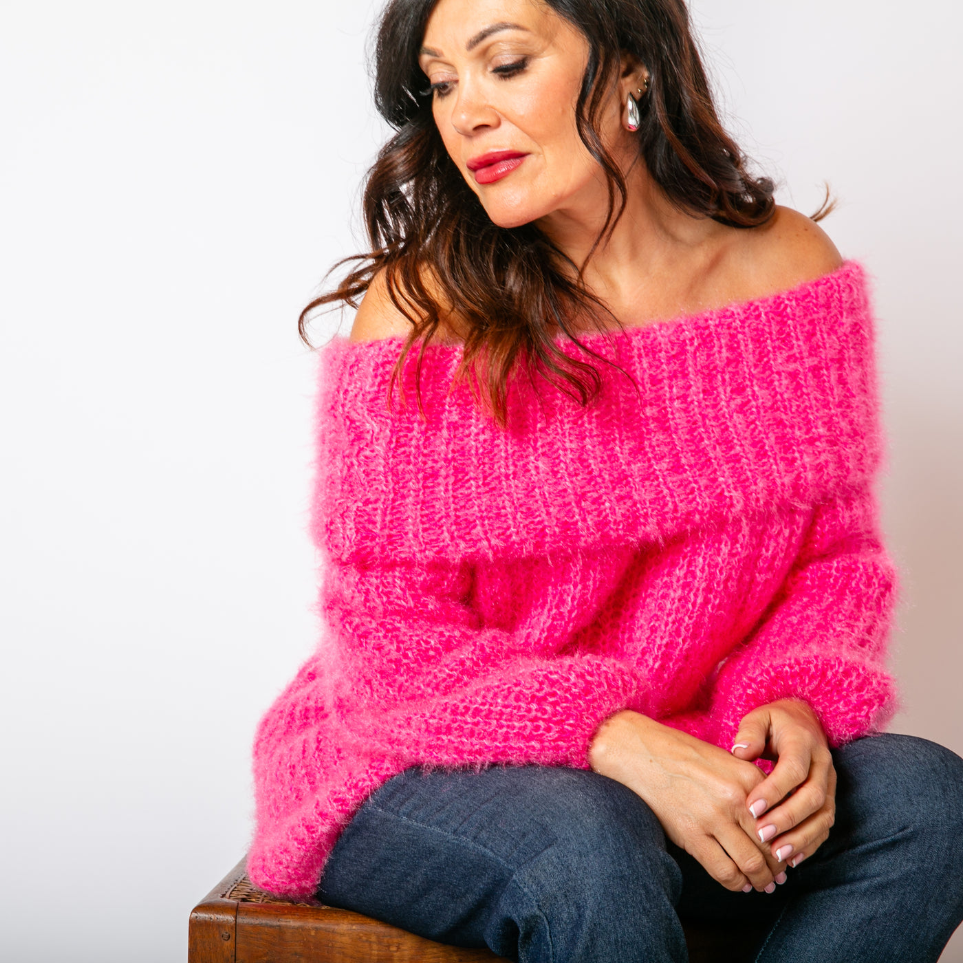 The Off Shoulder Jumper in fuchsia pink with a folded over bardot neckline