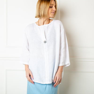 The white One Button Linen Top with an open front and button detailing on the chest
